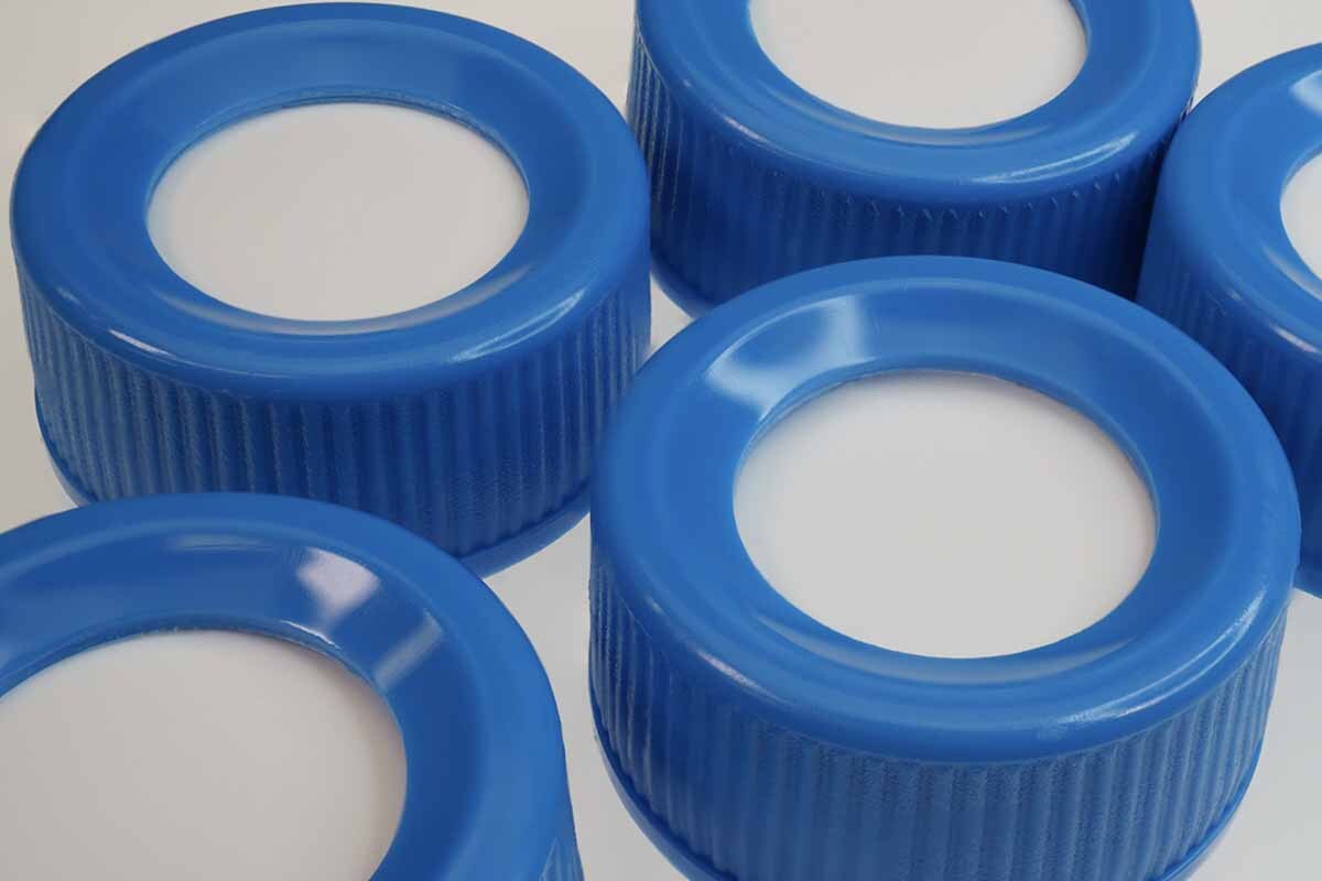 A group of blue uncut silicone septa caps designed for both manual and automated autosampler compatibility.